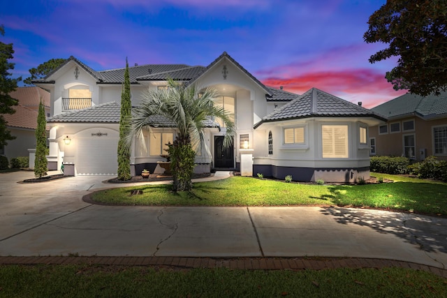 96 Garnet Pl, Destin, FL 32541 - view of front of house featuring a tile roof, driveway, a garage, and stucco siding