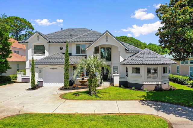 96 Garnet Pl, Destin, FL 32541 - view of front of home with a tile roof, concrete driveway, stucco siding, and a front lawn