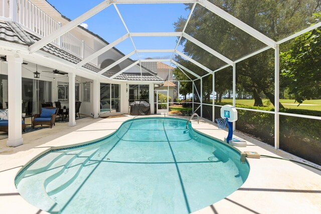 96 Garnet Pl, Destin, FL 32541 - outdoor pool featuring a patio area, a ceiling fan, glass enclosure, and an outdoor living space