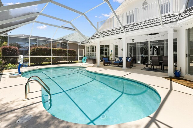 96 Garnet Pl, Destin, FL 32541 - swimming pool with a patio area, ceiling fan, glass enclosure, and an outdoor living space