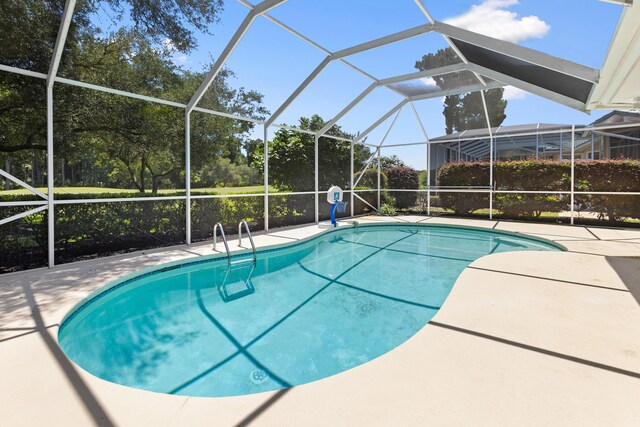 96 Garnet Pl, Destin, FL 32541 - swimming pool featuring a patio and view of scattered trees