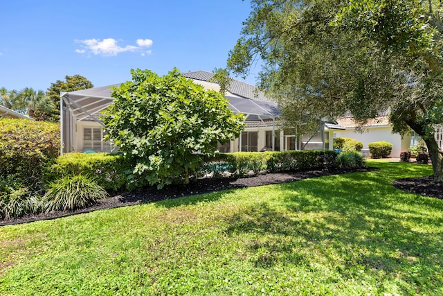 96 Garnet Pl, Destin, FL 32541 - view of front facade featuring a front yard and a lanai