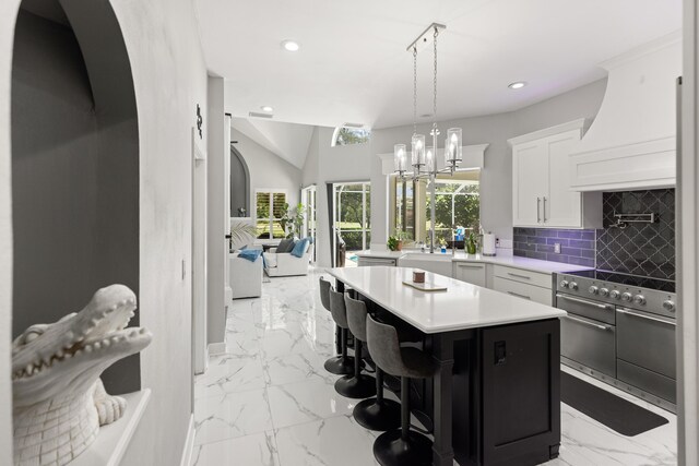 96 Garnet Pl, Destin, FL 32541 - kitchen featuring custom range hood, double oven range, light marble finish floors, recessed lighting, and light countertops