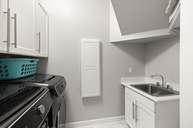 96 Garnet Pl, Destin, FL 32541 - washroom featuring washer and dryer, light marble finish flooring, and cabinet space