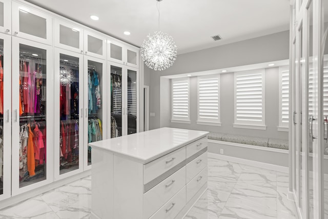 96 Garnet Pl, Destin, FL 32541 - spacious closet with light marble finish flooring and a chandelier