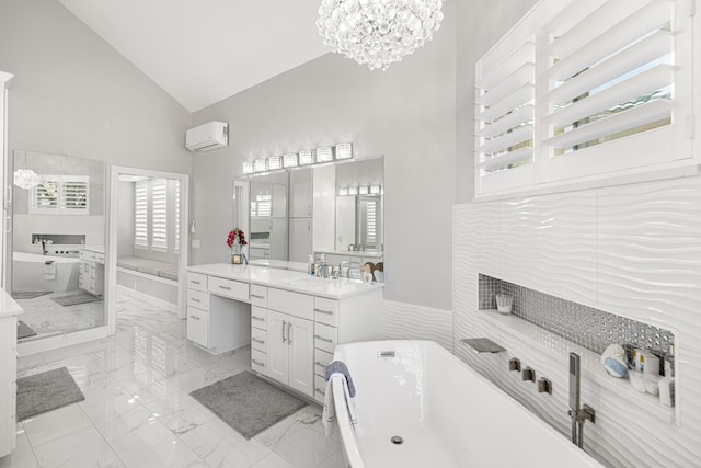 96 Garnet Pl, Destin, FL 32541 - full bath with vanity, high vaulted ceiling, a freestanding tub, marble finish floors, and a chandelier