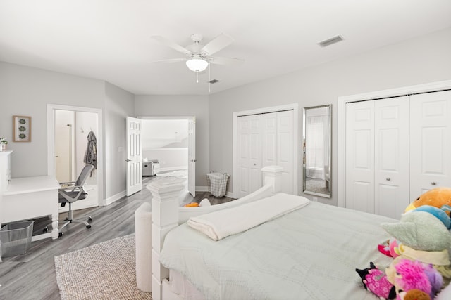 96 Garnet Pl, Destin, FL 32541 - bedroom featuring wood finished floors, two closets, a ceiling fan, and a desk