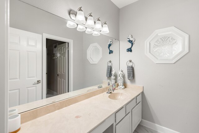 96 Garnet Pl, Destin, FL 32541 - bathroom featuring vanity, marble finish floors, and a chandelier