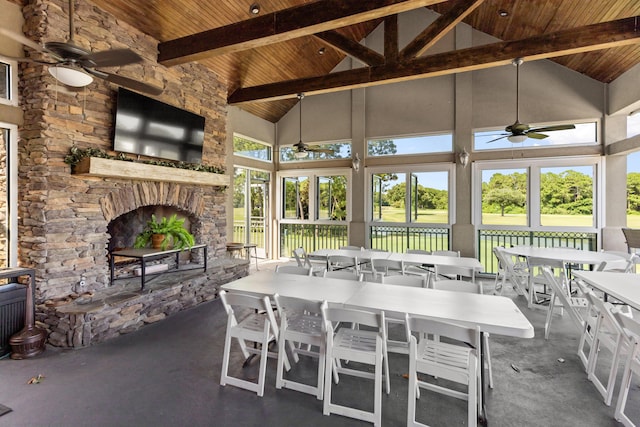 96 Garnet Pl, Destin, FL 32541 - sunroom with ceiling fan, outdoor dining area, and an outdoor stone fireplace