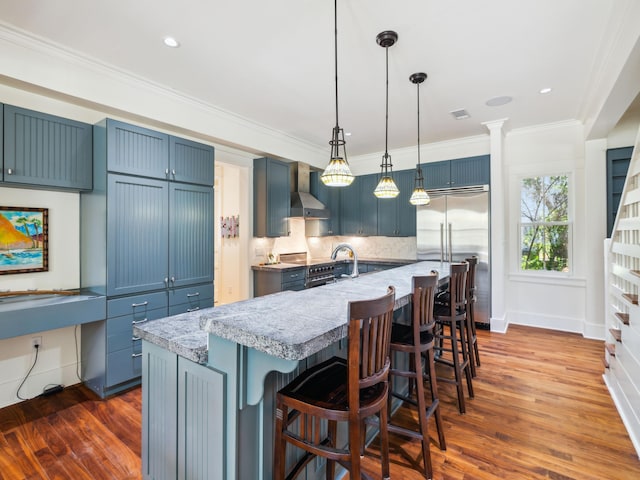 16 Beachberry Ln, Santa Rosa Beach, FL 32459 - kitchen with high end appliances, dark wood-style floors, tasteful backsplash, a breakfast bar area, and ornamental molding