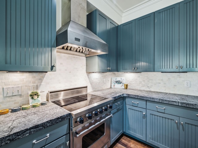 16 Beachberry Ln, Santa Rosa Beach, FL 32459 - kitchen with stainless steel range, wall chimney range hood, ornamental molding, decorative backsplash, and blue cabinets