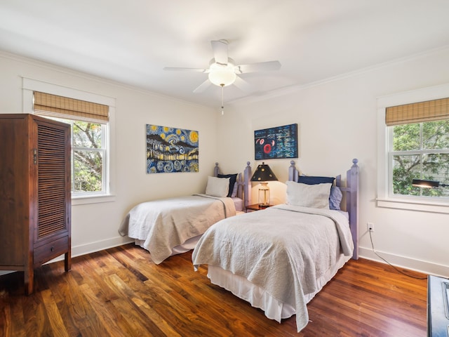 16 Beachberry Ln, Santa Rosa Beach, FL 32459 - bedroom with multiple windows, crown molding, wood finished floors, and a ceiling fan