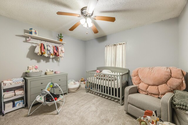 965 B St, Crestview, FL 32536 - bedroom with carpet, ceiling fan, a textured ceiling, and a crib
