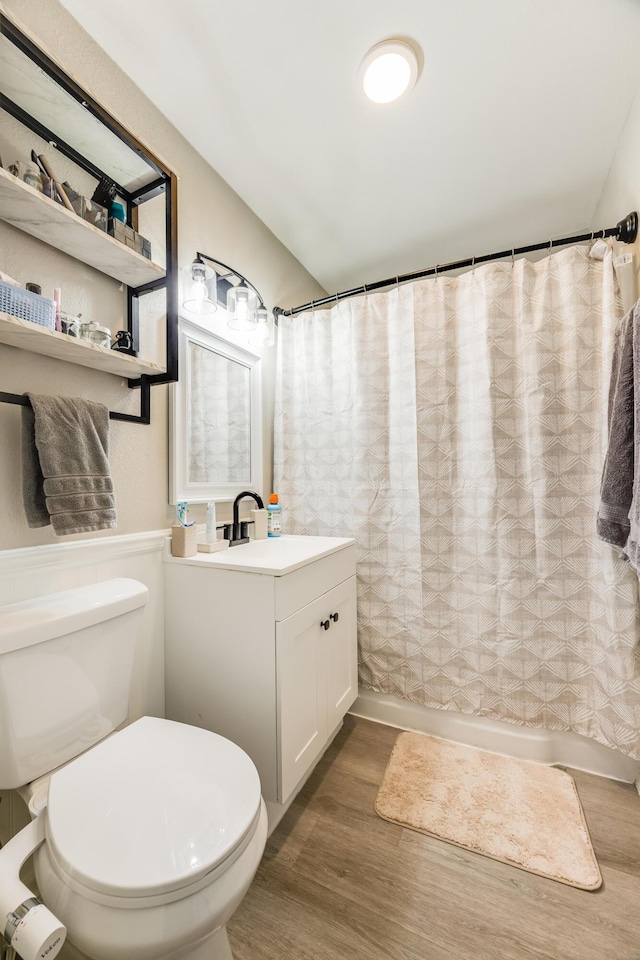 965 B St, Crestview, FL 32536 - bathroom featuring wood finished floors, vanity, and wainscoting