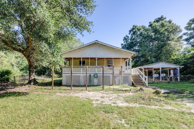 965 B St, Crestview, FL 32536 - view of front of home featuring stairway and a carport
