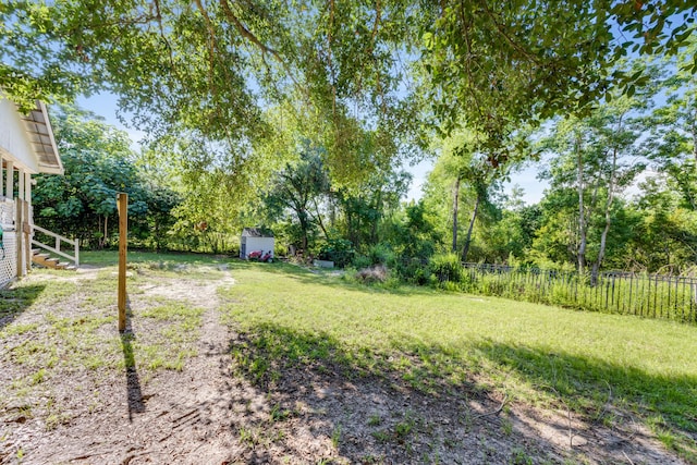 965 B St, Crestview, FL 32536 - view of yard featuring a storage unit and view of wooded area