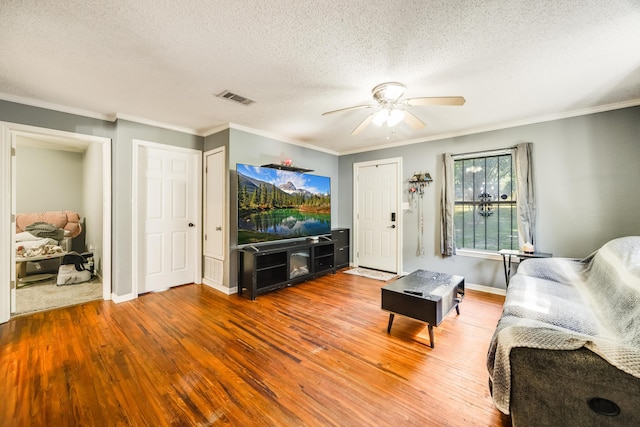 965 B St, Crestview, FL 32536 - living room with a ceiling fan, wood-type flooring, a textured ceiling, and ornamental molding