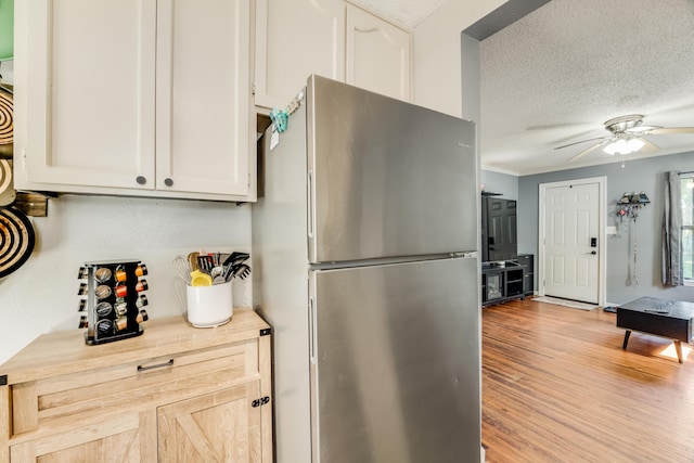 965 B St, Crestview, FL 32536 - kitchen featuring freestanding refrigerator, ceiling fan, light countertops, a textured ceiling, and light wood-style flooring