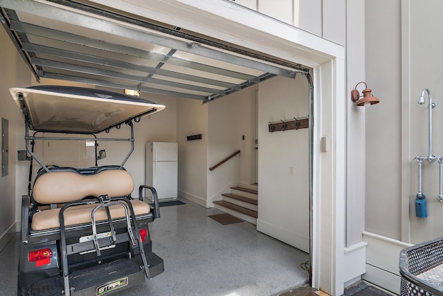 257 Matts Way, Santa Rosa Beach, FL 32459 - garage featuring freestanding refrigerator and electric panel