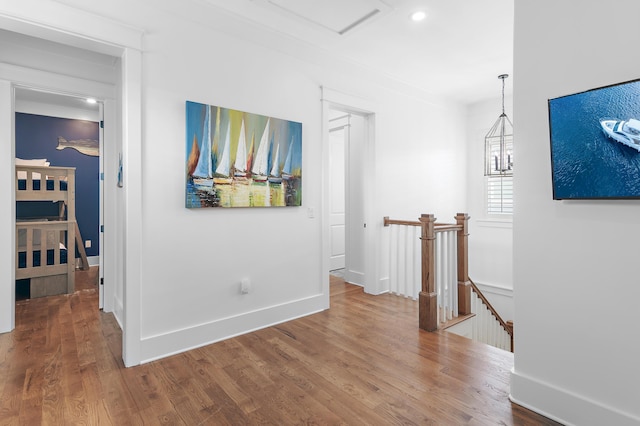 257 Matts Way, Santa Rosa Beach, FL 32459 - hallway with an upstairs landing, wood finished floors, attic access, and recessed lighting
