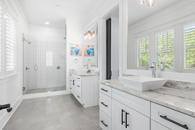 257 Matts Way, Santa Rosa Beach, FL 32459 - bathroom with tile patterned flooring, a stall shower, two vanities, ornamental molding, and recessed lighting