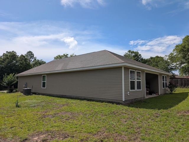 656 Hunters Ridge Rd, Defuniak Springs, FL 32433 - view of property exterior with a yard and a central AC unit
