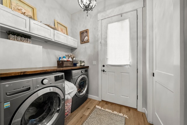 71 Childers Ln, Freeport, FL 32439 - washroom with washer and clothes dryer and light wood finished floors