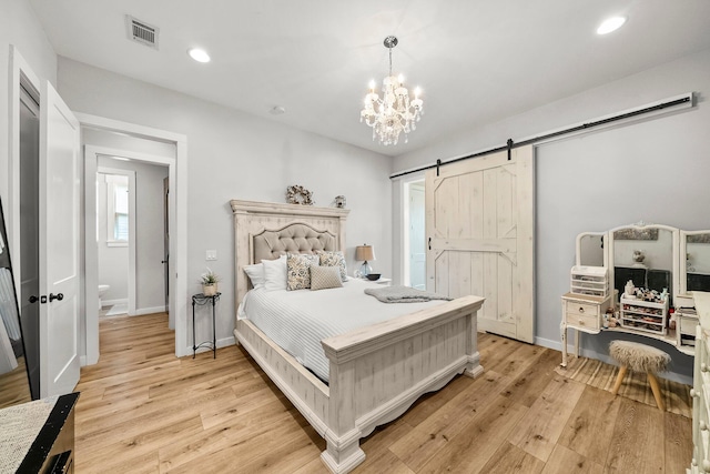 71 Childers Ln, Freeport, FL 32439 - bedroom featuring a barn door, light wood-style flooring, recessed lighting, and a chandelier