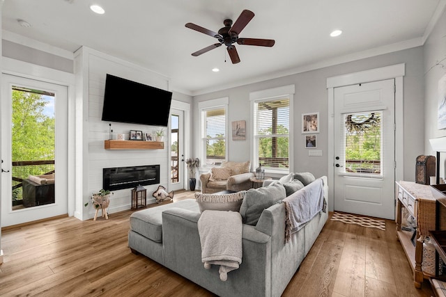 71 Childers Ln, Freeport, FL 32439 - living room featuring crown molding, wood-type flooring, a fireplace, ceiling fan, and recessed lighting