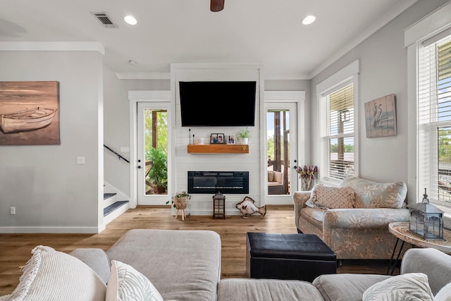 71 Childers Ln, Freeport, FL 32439 - living room featuring plenty of natural light, wood finished floors, recessed lighting, and ornamental molding