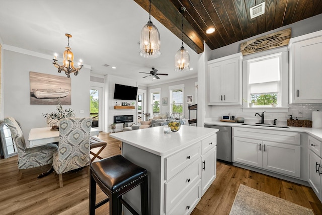 71 Childers Ln, Freeport, FL 32439 - kitchen with dishwasher, a chandelier, ceiling fan, backsplash, and plenty of natural light