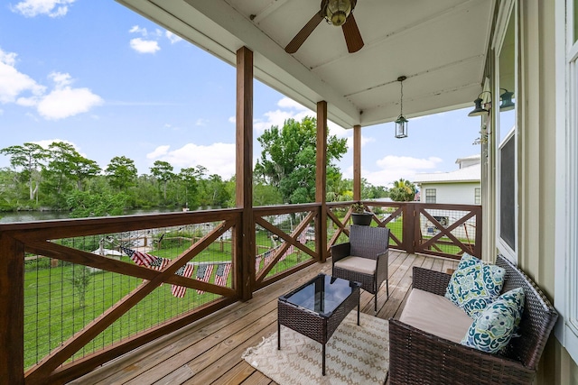 71 Childers Ln, Freeport, FL 32439 - wooden terrace featuring a ceiling fan and an outdoor hangout area