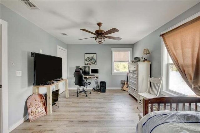 71 Childers Ln, Freeport, FL 32439 - bedroom with a desk and light wood-style floors