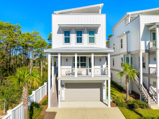 34 W Majestic Palm Dr, Inlet Beach, FL 32461 - coastal home with stairs, board and batten siding, an attached garage, and driveway