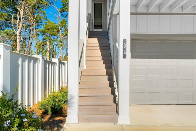 34 W Majestic Palm Dr, Inlet Beach, FL 32461 - property entrance with a garage and board and batten siding