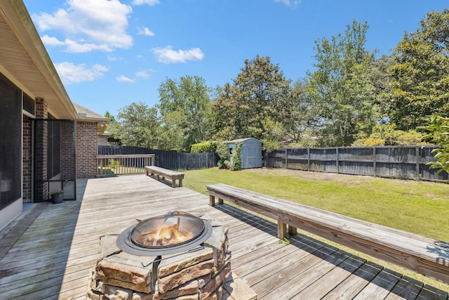 134 Mussett Bayou Ct, Santa Rosa Beach, FL 32459 - wooden terrace with an outdoor fire pit, a storage shed, and a fenced backyard