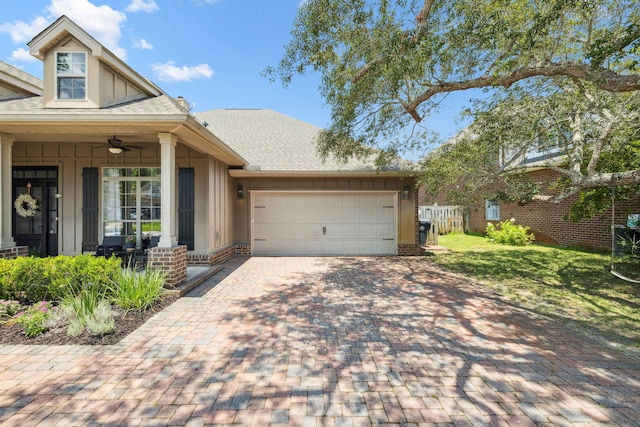 134 Mussett Bayou Ct, Santa Rosa Beach, FL 32459 - view of front of home featuring driveway, a garage, board and batten siding, covered porch, and ceiling fan