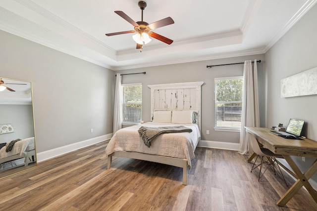 134 Mussett Bayou Ct, Santa Rosa Beach, FL 32459 - bedroom with a tray ceiling, wood finished floors, ornamental molding, and ceiling fan