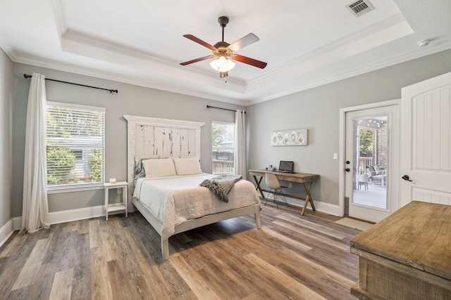 134 Mussett Bayou Ct, Santa Rosa Beach, FL 32459 - bedroom featuring a raised ceiling, crown molding, access to exterior, wood finished floors, and ceiling fan