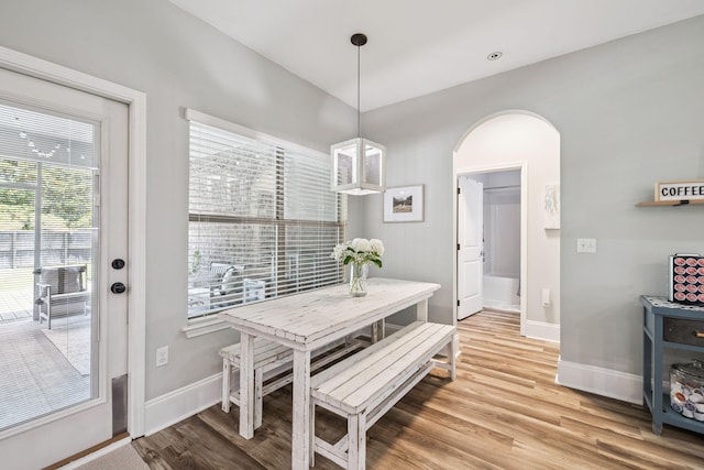 134 Mussett Bayou Ct, Santa Rosa Beach, FL 32459 - dining room featuring arched walkways and light wood-style flooring