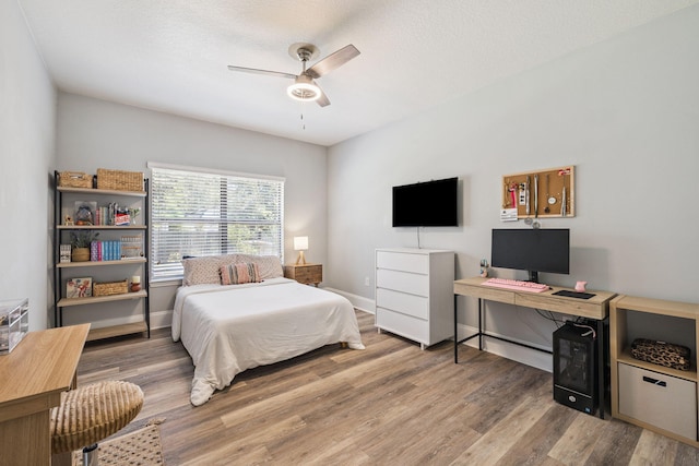 134 Mussett Bayou Ct, Santa Rosa Beach, FL 32459 - bedroom featuring wood finished floors and a ceiling fan