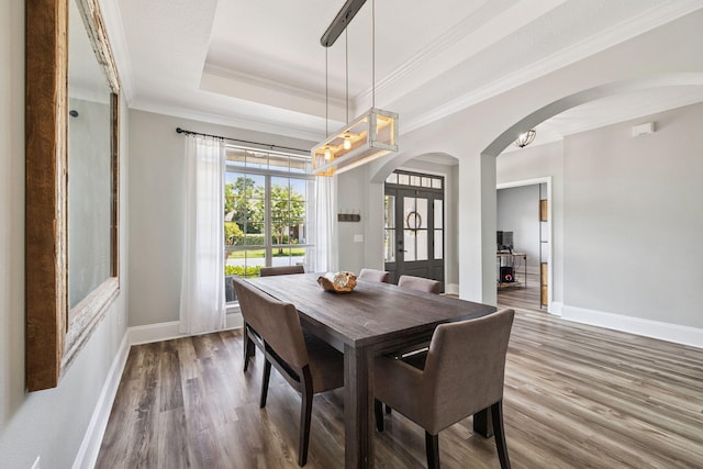 134 Mussett Bayou Ct, Santa Rosa Beach, FL 32459 - dining area with arched walkways, wood finished floors, french doors, crown molding, and a chandelier