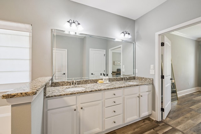 134 Mussett Bayou Ct, Santa Rosa Beach, FL 32459 - bathroom with double vanity and wood finished floors