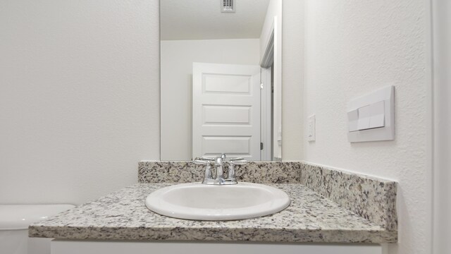 207 Eunola Ln, Freeport, FL 32439 - bathroom featuring vanity and toilet