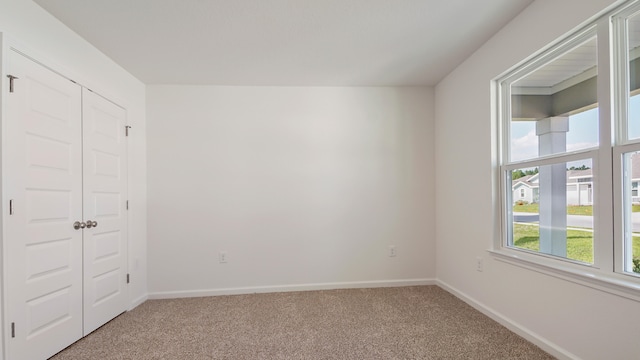 207 Eunola Ln, Freeport, FL 32439 - unfurnished bedroom with light carpet and a closet
