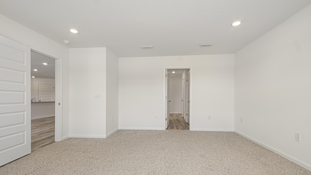 207 Eunola Ln, Freeport, FL 32439 - spare room featuring light carpet and recessed lighting