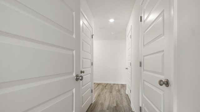 207 Eunola Ln, Freeport, FL 32439 - hallway featuring wood finished floors and recessed lighting