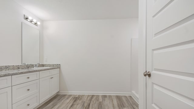 207 Eunola Ln, Freeport, FL 32439 - bathroom featuring vanity and wood finished floors