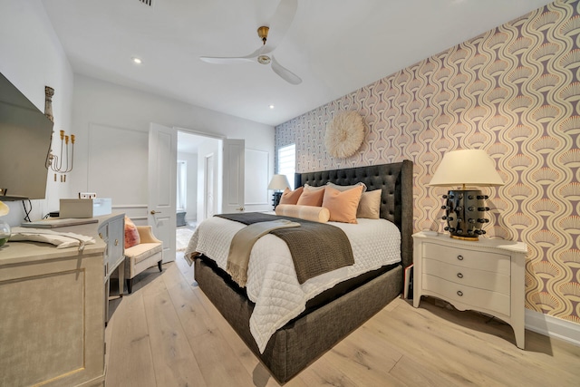 34 E Surfside Dr, Santa Rosa Beach, FL 32459 - bedroom featuring wallpapered walls, an accent wall, light wood-style flooring, ceiling fan, and recessed lighting