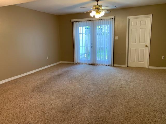 507 Chinas Cv Unit C, Fort Walton Beach, FL 32547 - unfurnished room with a ceiling fan and carpet flooring